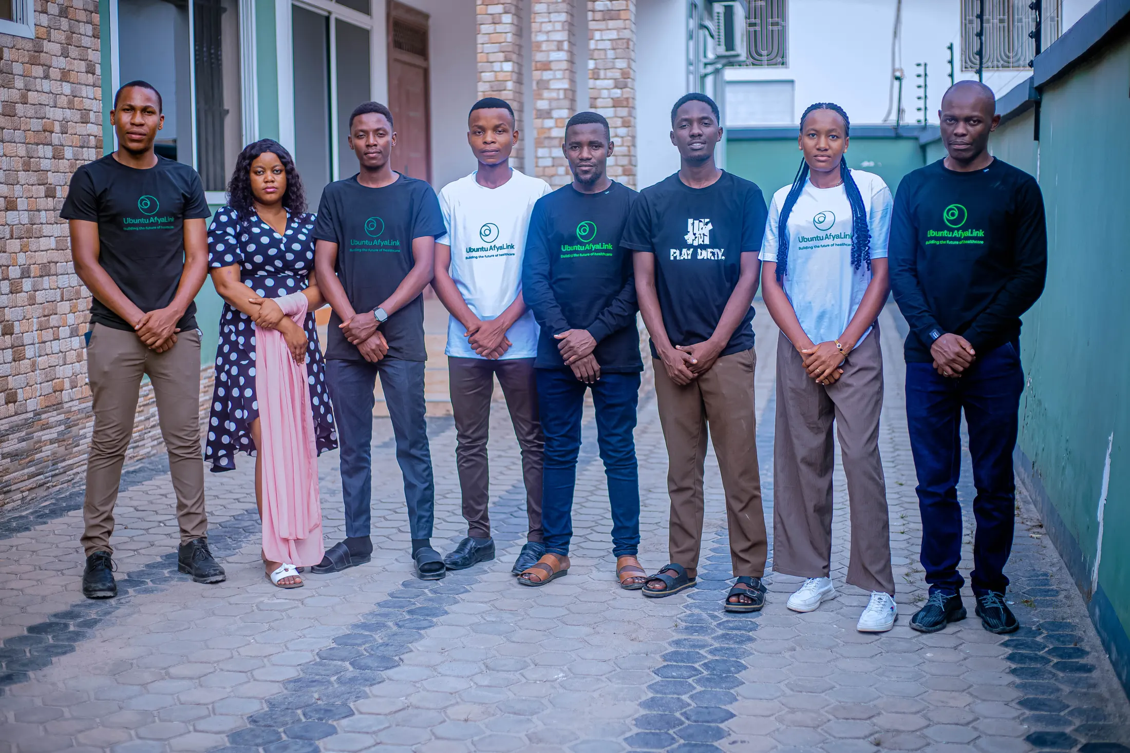 The Ubuntu AfyaLink team standing together in branded shirts