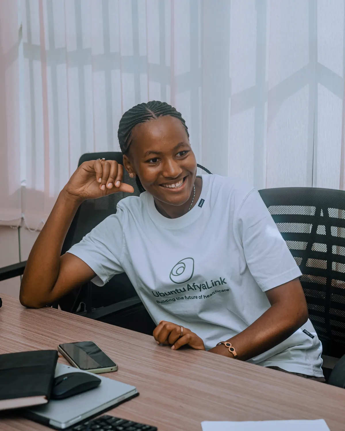 Smiling young woman from the AfyaLink team