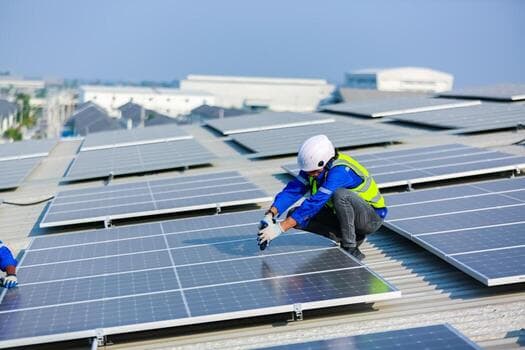 Solar technician working on solar panels